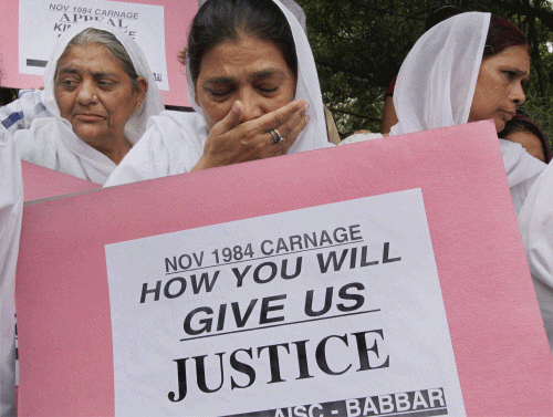 Victims of 1984 anti-Sikh riots during a protest demanding justice at Rajghat in New Delhi PTI file photo