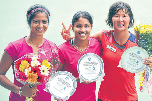 jubilant: (From left) Doubles winners Sharrmadaa Baluu and Prarthana Thombare along with singles champion Ching-Wen Hsu with their spoils in Bangalore on&#8200;Saturday. dh photo