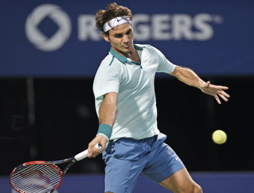 Roger Federer (SUI) plays a forehand against Feliciano Lopez (ESP) on day six of the Rogers Cup tennis tournament at Rexall Centre. Federer won 6-3 6-4. Reuters photo