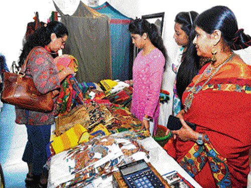 Visitors choose from a variety of sarees themed on Navrang.