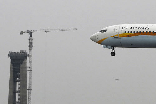 Jet Airways, which reported Rs 217 crore net loss in the June quarter, today said it will be exiting low-cost services and will merge its two no-frills brands with parent full service carrier. Reuters photo