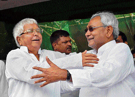 RJD chief Lalu Prasad and senior JD(U) leader Nitish Kumar at a by-election rally in Hajipur on Monday. PTI