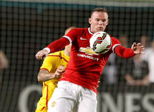 Wayne Rooney has been named Manchester United captain by new manager Louis van Gaal, the club announced / Ap Photo