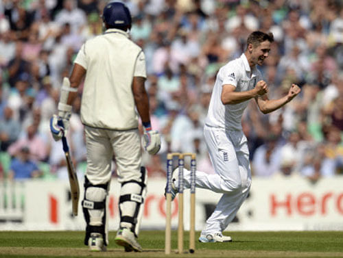 England's Woakes celebrates after dismissing India's Vijay during the fifth cricket test match at the Oval cricket ground in London. Reuters photo