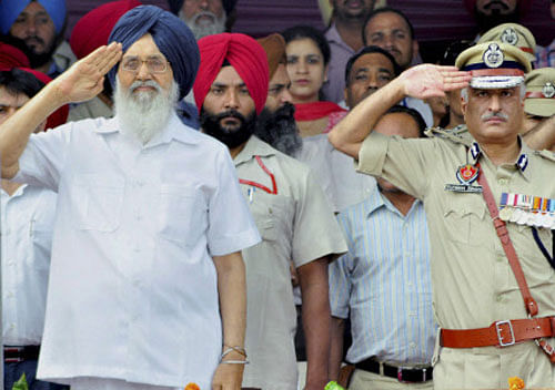 Punjab Chief Minister Parkash Singh Badal inspects the guard of honour during the Independence Day function at the Yadavindra Stadium in Patiala on Friday. PTI Photo