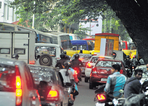 Jam-packed: The traffic moves at a snail's pace on Queen's Road.