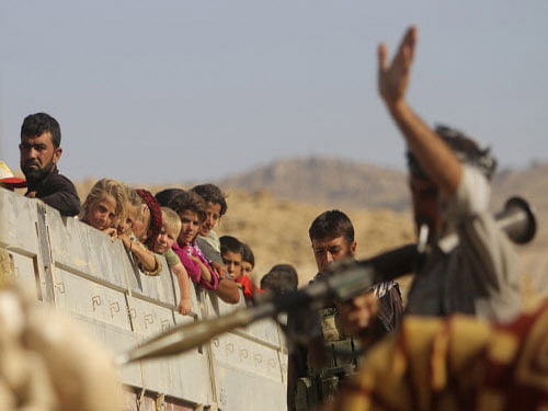 In a dusty, ill-equipped camp in northern Iraq, Yazidis fleeing a jihadist offensive say members of their families - men, women and even babies - have been abducted by militants. Reuters photo