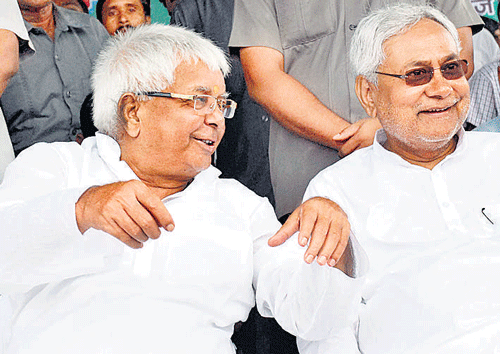 RJD chief Lalu Prasad and JD(U) senior leader Nitish Kumar at a by-election rally in Hajipur on Monday. PTI photo