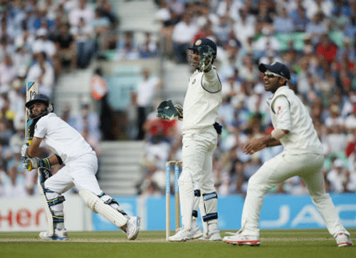 England's Moeen Ali, left, hits a ball off the bowling of India's Ravichandran Ashwin during the second day of the fifth test cricket match at Oval cricket ground in London, Saturday, Aug. 16, 2014. AP Photo
