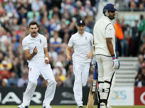 James Anderson celebrates after taking the wicket of Murali Vijay, LBW, during the third day of the fifth test cricket match at Oval cricket ground in London. AP photo