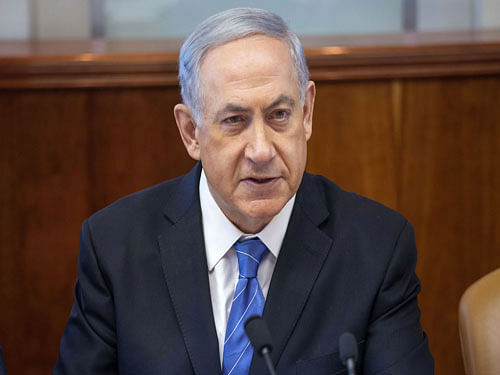 'We are in the midst of a combined military and diplomatic campaign...If Hamas thinks that it can cover up its military loss with a diplomatic achievement, it is mistaken,' Netanyahu told his cabinet at its weekly meeting today. AP photo