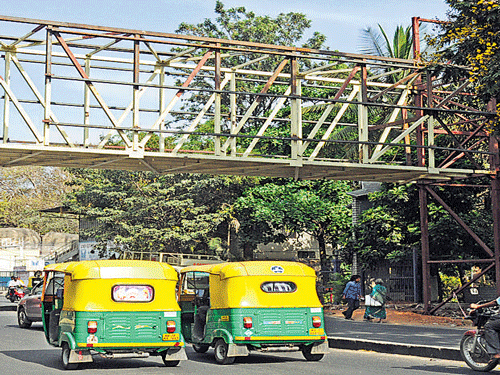 The construction of a skywalk is in full swing near Christ University on Hosur Road. DH photo