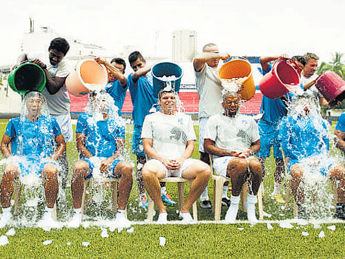 SAY FREEZE: Players of the Bengaluru Football Club take up the Ice Bucket Challenge at the Bangalore Football Stadium on Monday.