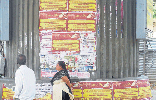 Dirty: Fliers are often seen on the pillars of metro stations like Swami Vivekananda (left), Trinity (top right) and MG Road (bottom right). DH Photos by SK Dinesh