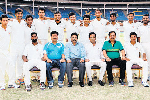 champions Mount Joy Cricket Club, winners of the KSCA Group I Division II league for the MAT Acharya Shield. STANDING (L-R):  Naveen Yadhav, MN Ramana, Shashank Kashyap,  S Suhas, M Vijaya Kumar, Shivil K, Sharath BR, Prasid M Krishna, Farah Megi, IG Anil, AM Kiran, Akash Shenvi. SITTING: Vishwanath M, Praveen Kumar (coach), BK Ravi (secretary),  Sangathi Venkatesh (patron), BK Kumar (president), Harish Kumar (captain).