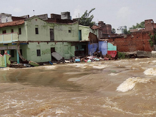 A damaged house in flood-affected Parwalpur in Bihar Sharif on Wednesday. PTI