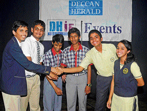 Winners of senior division Deccan Herald in Education (DHiE) quiz competition congratulate each other, on Wednesday. From left: Amrit Sodi and Hari Kartik Ramesh (first) of St Joseph's Boys High School, Nrupathunga H and S Roshan Sameer (second) of Kendriya Vidyalaya, Indian Institute of Science, and Saishyam Srikanth and Shreya Shankar (third) of Sri Ravishankar Vidya Mandir. DH photo