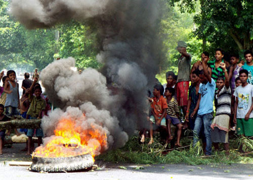 Protestors block the National Highway 37 at Geleki in Kaziranga , Assam against the killing of Assamese people by suspected NSCN at Assam Nagaland border in Golaghat on Wednesday.PTI Photo