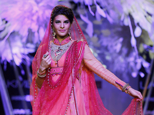 Actress Jacqueline Fernandez turned up in a bridal lehenga as the showstopper for designer Anju Modi at the ongoing Lakme Fashion Week Winter/Festive 2014 here. AP file photo