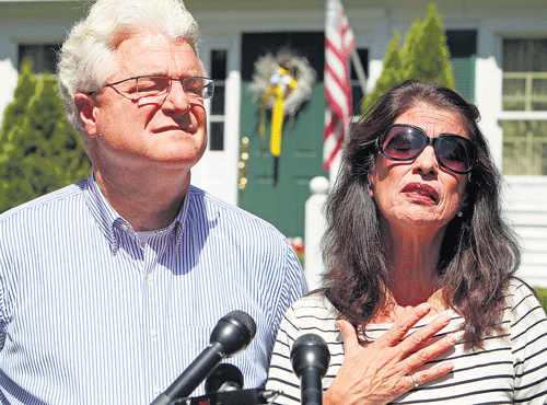 Reeling from a loss: Diane and John Foley talk to reporters after speaking with US President Barack Obama on Wednesday, outside their home in Rochester, N.H. Their son, James Foley was abducted in November 2012 while covering the Syrian conflict. Islamic militants posted a video showing his murder on Tuesday and said they killed him because the US had launched airstrikes in northern Iraq. Ap