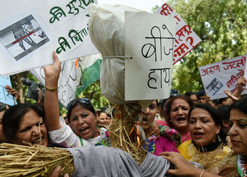 ongress Mahila Morcha members protesting against Defence Minister Arun Jaitley over his remark calling the Delhi gang-rape 'one small incident' in New Delhi on Friday. PTI Photo
