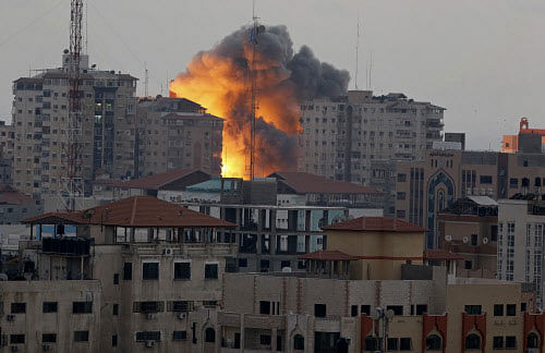 Gaza police say Israeli airstrikes have leveled a seven-floor office building and severely damaged a two-story commercial building with dozens of shops in the southern town of Rafah. AP photo