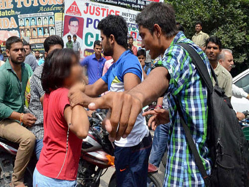 Accusing police of harassment, the woman who took on a group of attackers singlehandedly on a busy street, today said the cops were dilly-dallying in acting against the accused and threatened to commit suicide if she does not get justice. PTI photo