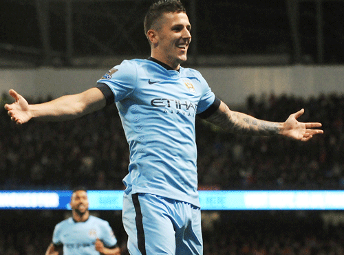 Manchester Citys Stevan Jovetic celebrates after scoring his second goal against Liverpool during the English Premier League soccer match between Manchester City and Liverpool at the Etihad Stadium, in Manchester, England, Monday, Aug. 25, 2014. AP Photo
