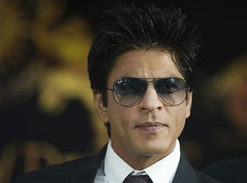 Superstar Shah Rukh Khan, who will be seen performing stunts in his upcoming film 'Happy New Year', says he does all the heroic things on-screen for his children Aryan and Suhana. Reuters photo