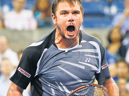 StanislasWawrinka lets out a mighty roar after battling past Thomaz Bellucci in the second round of the US Open on Wednesday. REUTERS