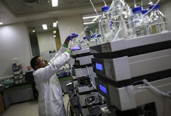 An employee works inside a laboratory at Piramal's Research Centre in Mumbai August 11, 2014. Reuters