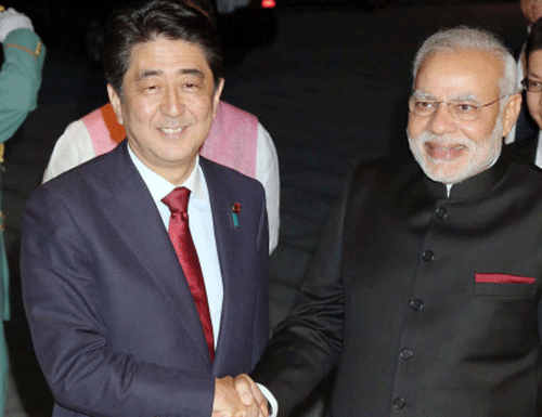 India's Prime Minister Narendra Modi (front R) shakes hands with Japan's Prime Minister Shinzo Abe upon his arrival at the State Guest House in Kyoto, western Japan. Reuters photo