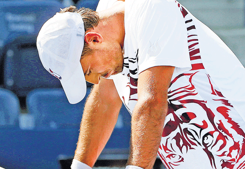 Tough world: The struggles of Ivan Dodig at the US Open highlighted the need to shorten the men's game. AP