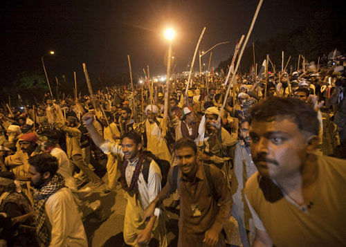 Utter chaos prevailed in the VIP area of the Pakistan capital late tonight with the 17-day-old standoff between protesters and the government taking a new turn after thousands of protesters armed with lathis broke through security cordons and were marching towards the residence of the besieged Prime Minister Nawaz Sharif. Reuters photo