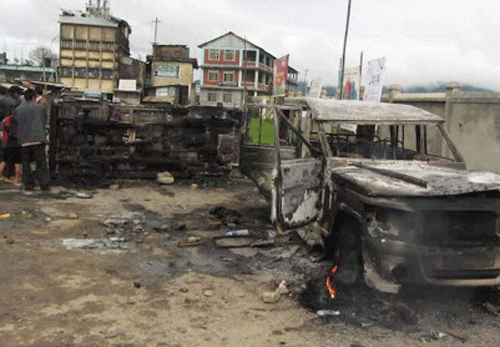 Protesters set a police vehicle on fire in Ukhrul on Saturday demanding immediate solution to Indo-Naga Peace talk and alternative arrangement for Naga inhabited area. PTI Photo