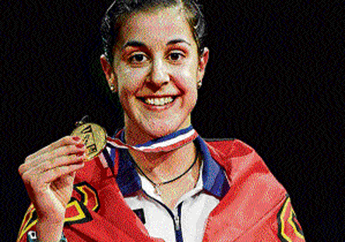sucker punch Spain's Carolina Marin is a picture of delight after winning the World Championship gold. afp