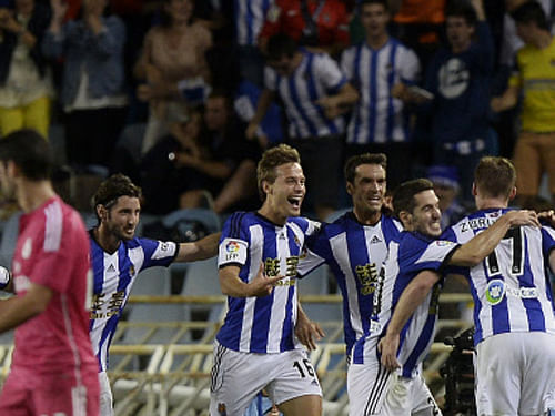 Real Sociedad's players celebrate a goal during their Spanish first division soccer match against Real Madrid at Anoeta stadium in San Sebastian. Reuters photo