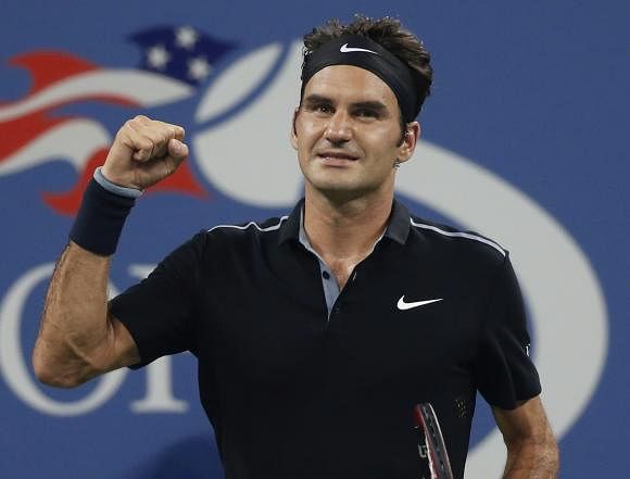 Roger Federer of Switzerland celebrates defeating Roberto Bautista Agut of Spain in men's singles play following their match at the 2014 U.S. Open tennis tournament in New York, September 2, 2014. Reuters