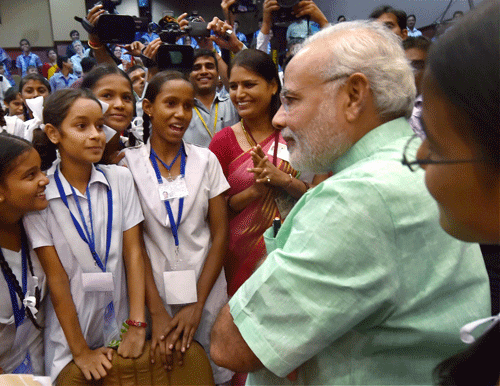 On Teachers Day, Prime Minister Narendra Modi today interacted with school children across the country saying girl education is his top priority and the initiative to ensure toilets in all schools was part of this endeavour. PTI Photo