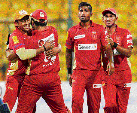 We got him: Mangalore United players celebrate the fall off Bellary Tuskers' Manish Pandey during their KPL encounter in Bangalore on Friday. dh photo