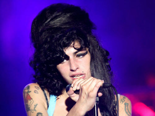 Janis Winehouse has revealed in a new book that her daughter and singer Amy Winehouse 'reeked of alcohol' and struggled to communicate the last time she saw her alive. Reuters file photo