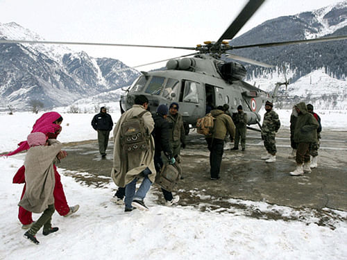 Armed forces today stepped up rescue efforts in flood-hit Jammu and Kashmir where 12,500 people have so far been evacuated to safety by the army while air force pressed more planes and choppers into service and opened a disaster monitoring cell to deal with the crisis. PTI Image