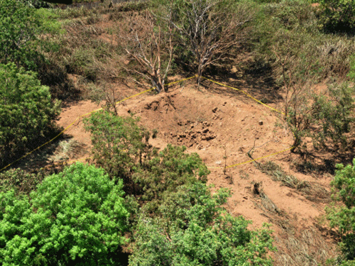 In this Sunday Sept. 7, 2014, publicly distributed handout photo provided by the Nicaraguan Army shows an impact crater made by a small meteorite in a wooded area near Managua's international airport and an air force base. Nicaraguan government spokeswoman Rosario Murillo said Sunday that a loud boom heard overnight by residents of the capital was a 'relatively small' meteorite that 'appears to have come off an asteroid that was passing close to Earth.' AP Photo