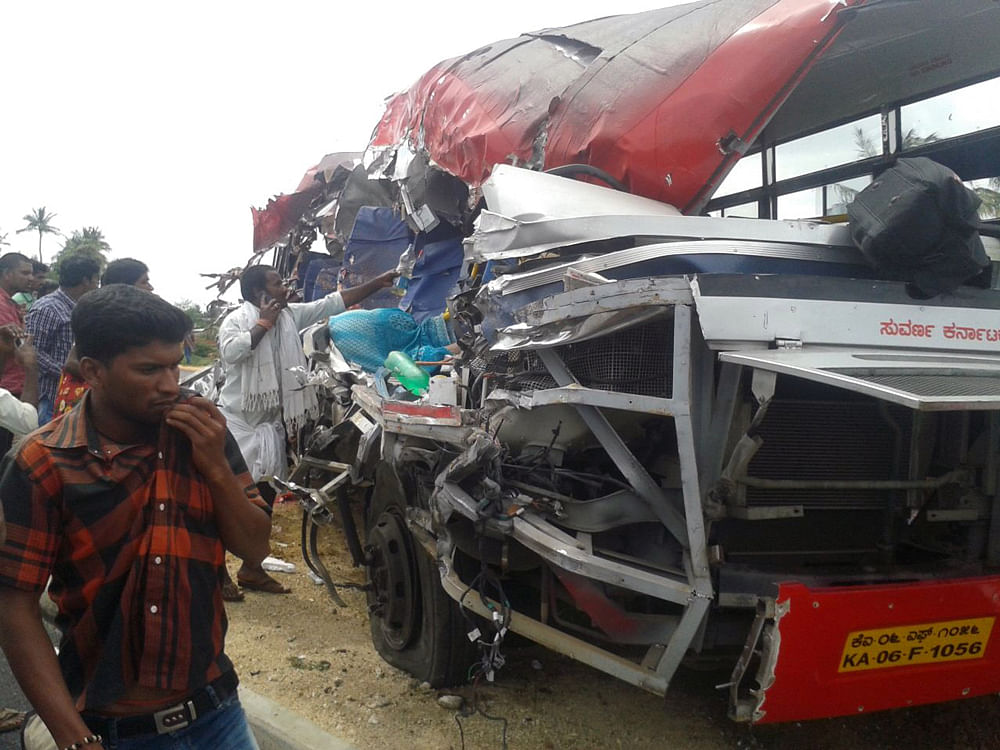Thirteen persons were killed and 17 others injured in a collision between a bus and a lorry on a national highway near Voddenahalli in the district today, police said. DH photo