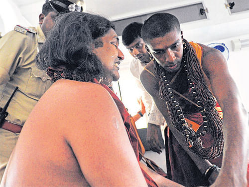 Nithyananda comes out of Victoria Hospital in Bangalore after undergoing a potency test on Monday. DH Photo