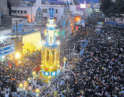 annual tryst: A large number of devotees take part in the chariot procession organised as part of of St Mary's feast in the City on Monday.  dhphoto