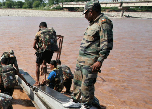 Thanks to distress calls received on social media applications such as WhatsApp and Facebook, the Army has been able to save a nine-month pregnant woman stranded on the third floor of a building in a locality in Srinagar marooned in 12-13 ft water / PTI photo only for representation