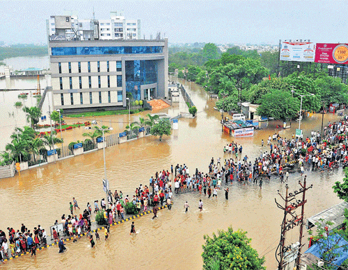 Towards safety: An aerial view of a flooded locality in Vadodara on Wednesday. PTI