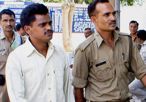 The mother of Nithari murders convict Surendra Koli Thursday maintained that her son was innocent and said Koli's employer Moninder Singh Pandher was responsible for the killings. PTI file photo