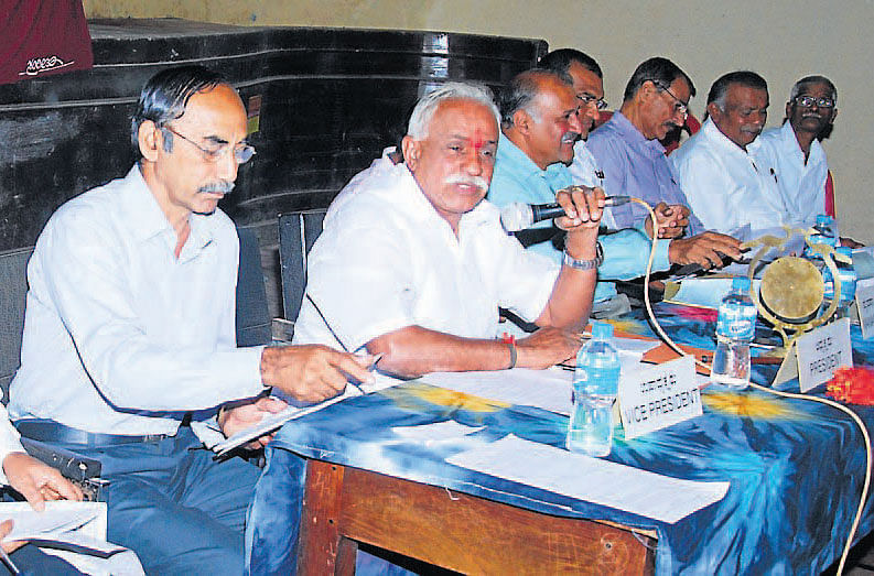 Coffee Planters' Co-operative Society President M B Devaiah chairs the annual general body meeting of the society at Cauvery Kalakshetra in Madikeri  on Thursday. Vice President B Tata Changappa, Managing Director G R Vijaykumar and others look on.